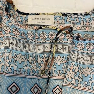 Women’s multi-pattern dress. Length hits right at or above the knee